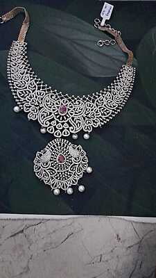 rangoli and peacock ad neckpiese