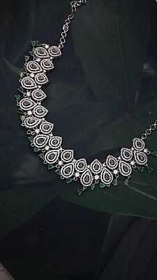 Lotus peatal design with green stone