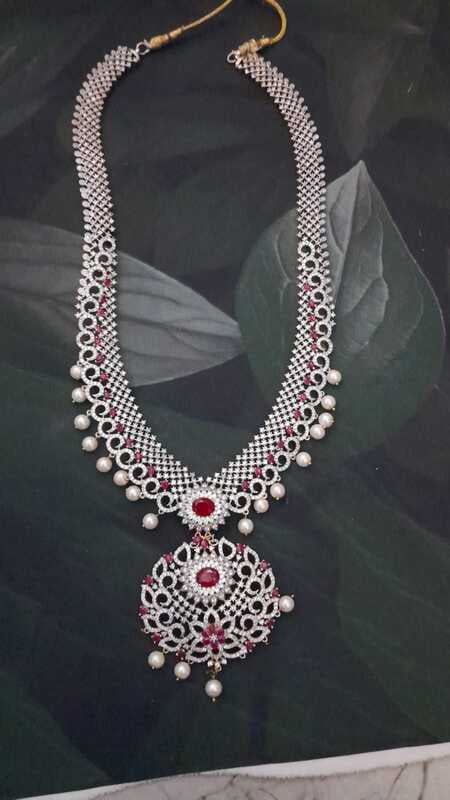 Long haram with pink stone and white beads Long haram with pink stone and white beads