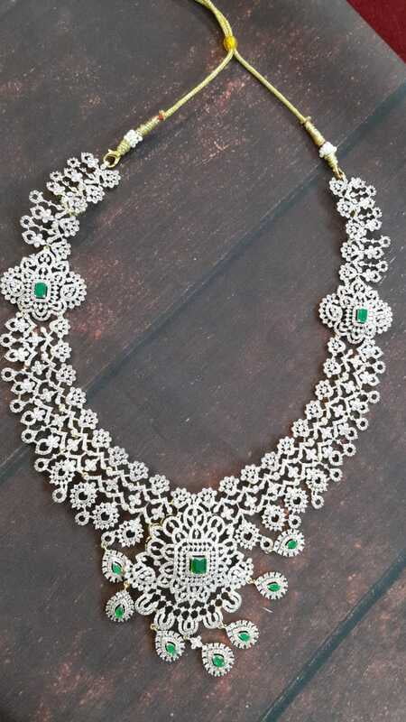 Little flower design with green stone Little flower design with green stone