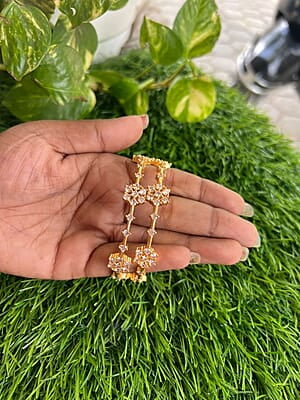 Gold finish AD stone flower design bangle Gold finish AD stone flower design bangle