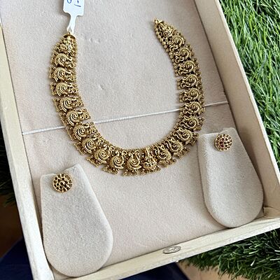 Peacock design gold finish necklace