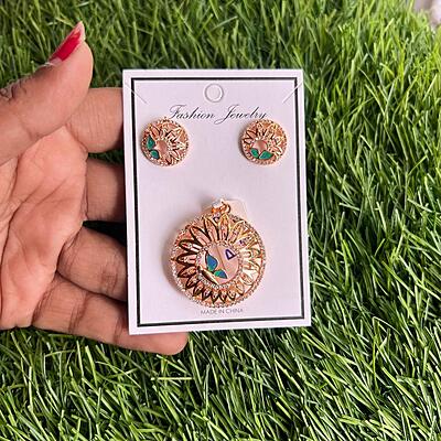 Fancy floral design within little roun butterfly with stone pendant earning set