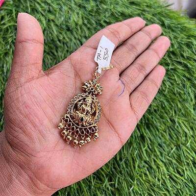 Traditional lakshmi design with multi stone nd gold pearl tikka