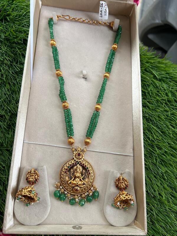 Unique lakshmi design within circle and green beads longharam Unique lakshmi design within circle and green beads longharam