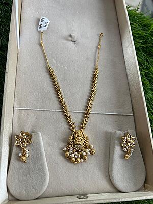 Traditional lakshmi design with pearl and gold beads  neckpiece