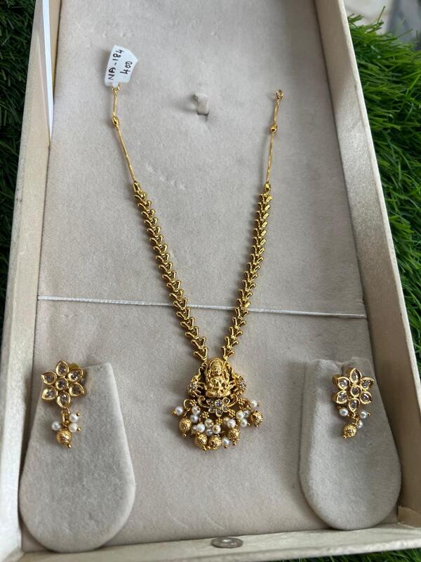 Traditional lakshmi design with pearl and gold beads  neckpiece