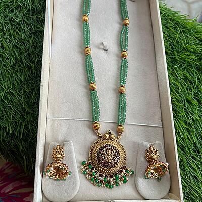 Unique lakshmi design within circle and green beads longharam Unique lakshmi design within circle and green beads longharam