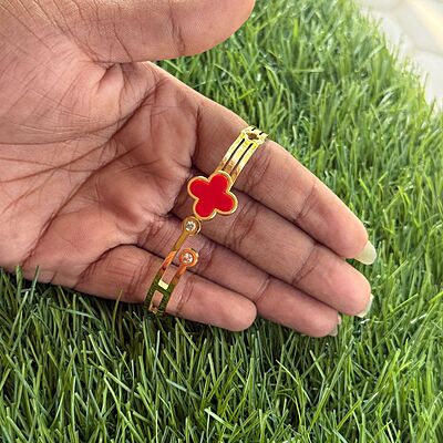 Red colour four petal flower design gold plated bracelet
