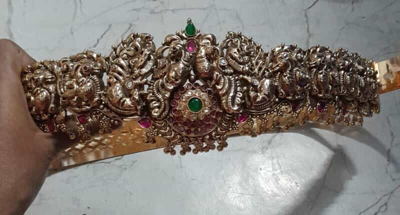 green stone with peacock design silver hipblet