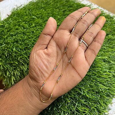 trendy gold finished chain with white enable design