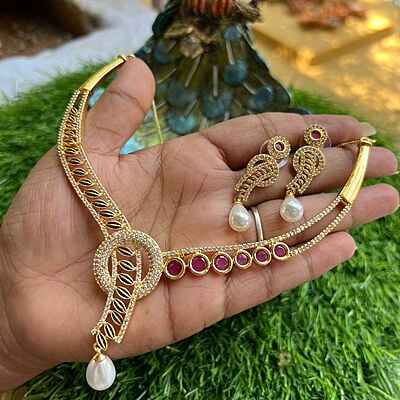 Trendy unique design AD stone gold finish neckpiece with earings