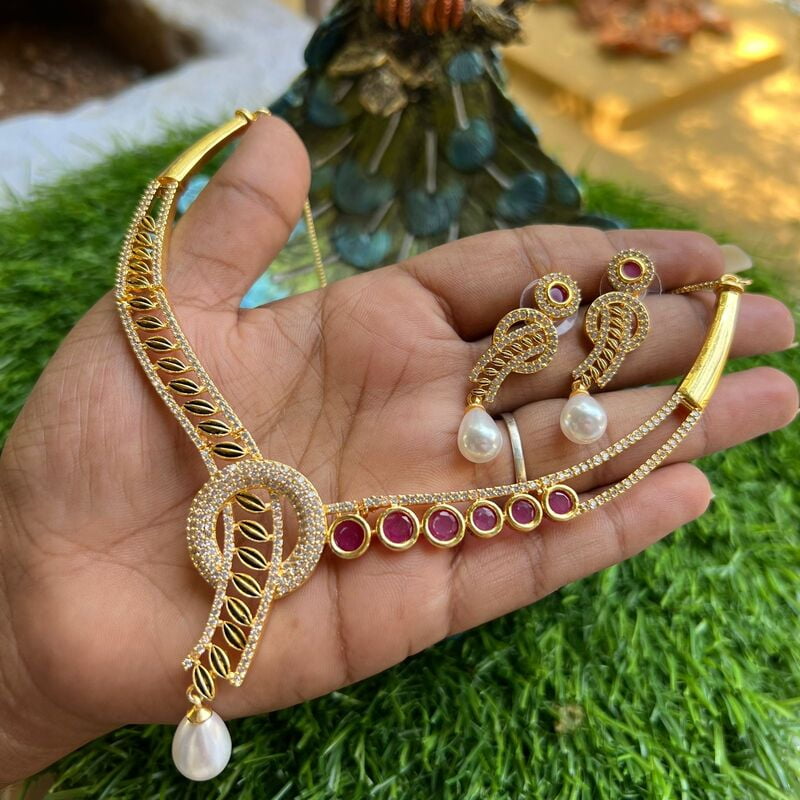 Trendy unique design AD stone gold finish neckpiece with earings
