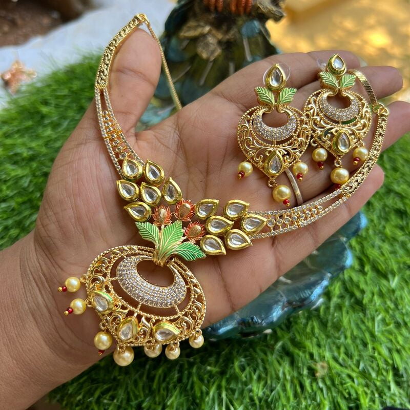 Gold finish AD stone trendydesign neckpiece with earings