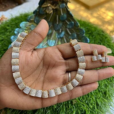 Fancy gold and silver finish AD stone neckpiece with earing