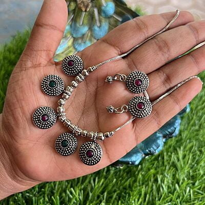 Silver finished chain with ruby stone pendant Silver finished chain with ruby stone pendant