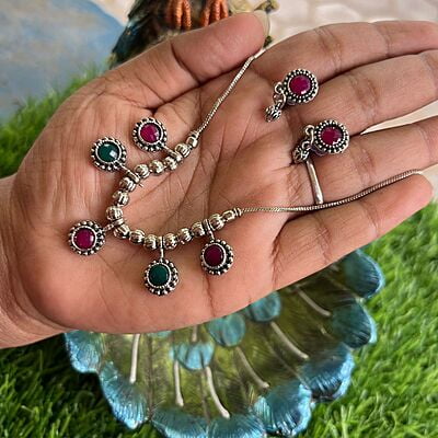 Silver finished chain with ruby stone pendant Silver finished chain with ruby stone pendant