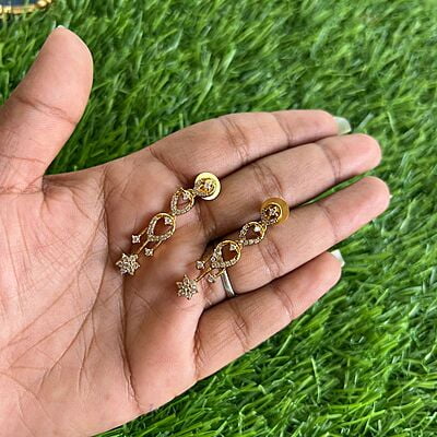Gold finished Long haram with AD flower design Gold finished Long haram with AD flower design