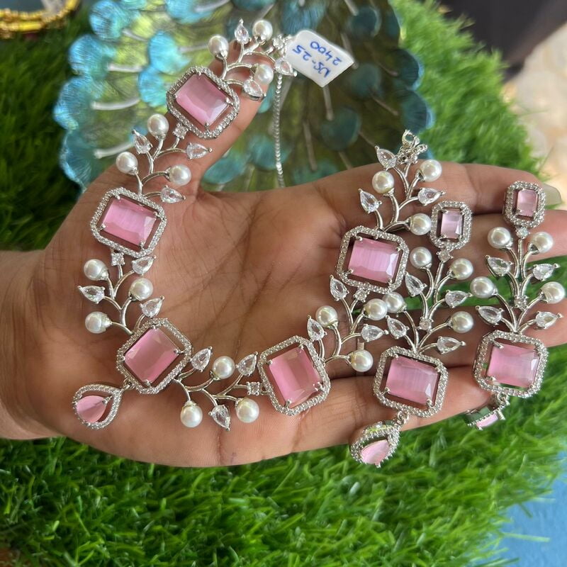 Party wear Silver neckpiece set with earings designed in pearl & ruby stone