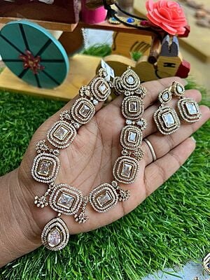 Exclusive gold finished Victorian neckpiece with AD stones Paired with Earings