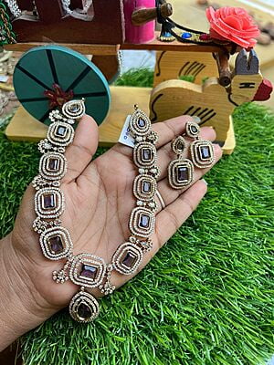 Exclusive gold finished Victorian neckpiece with AD stones Paired with Earings