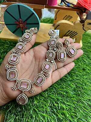 Exclusive gold finished Victorian neckpiece with AD stones Paired with Earings