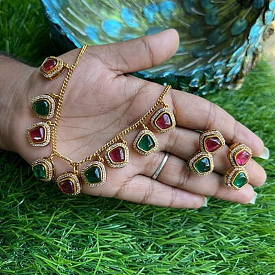 Gold finish Ruby Stone neckpiece with Earing Gold finish Ruby Stone neckpiece with Earing