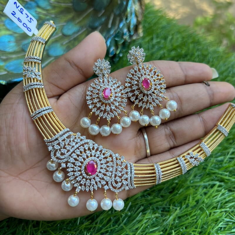 Unique gold finish AD stone Neckpiece with Earing