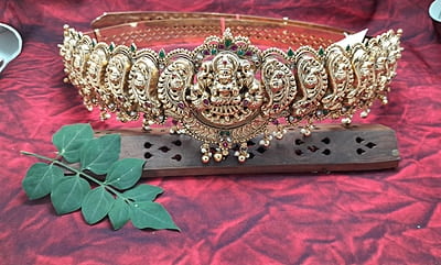lakshmi with peacock design silver hipblet