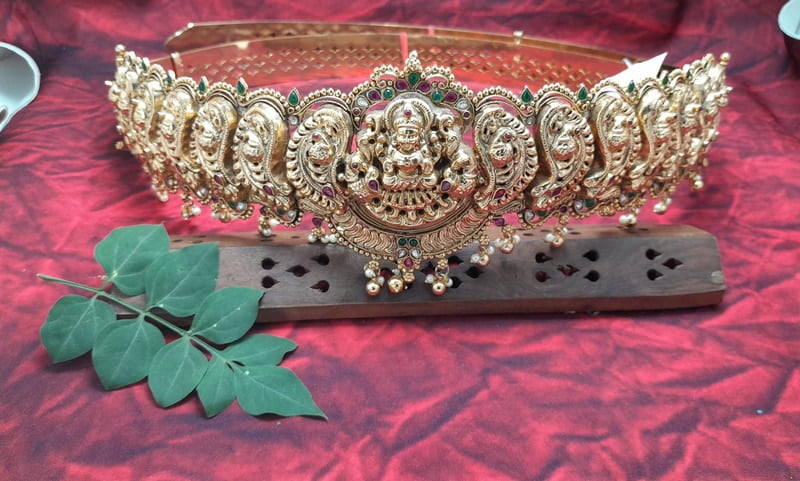 lakshmi with peacock design silver hipblet
