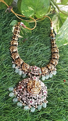 green bed and stone based lakshmi neckpiece