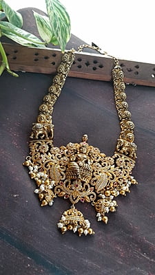 full white stone with big dollar neckpiece