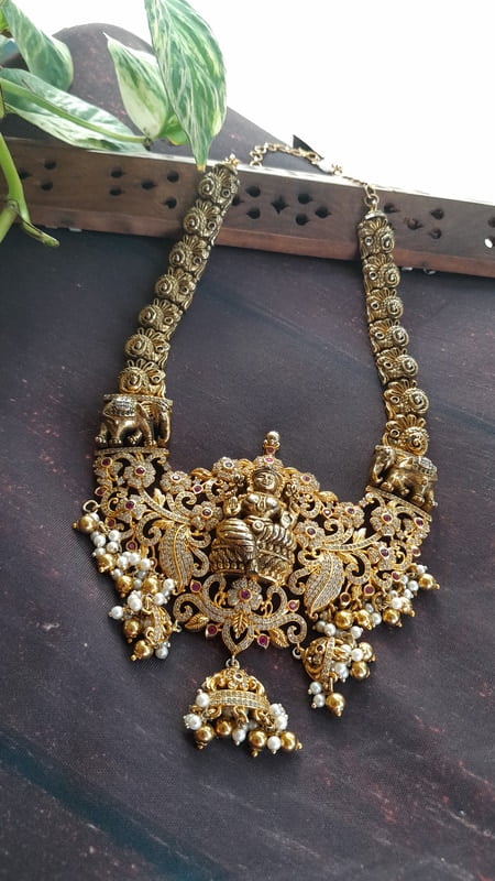 full white stone with big dollar neckpiece