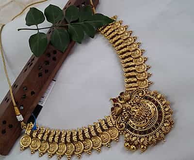 coin with peacock design neckpiece