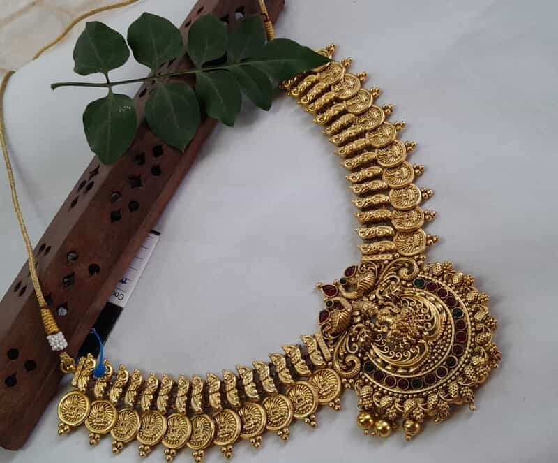 coin with peacock design neckpiece
