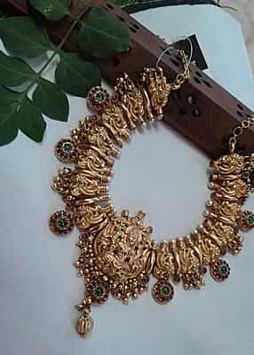peacock with red stone neckpiece