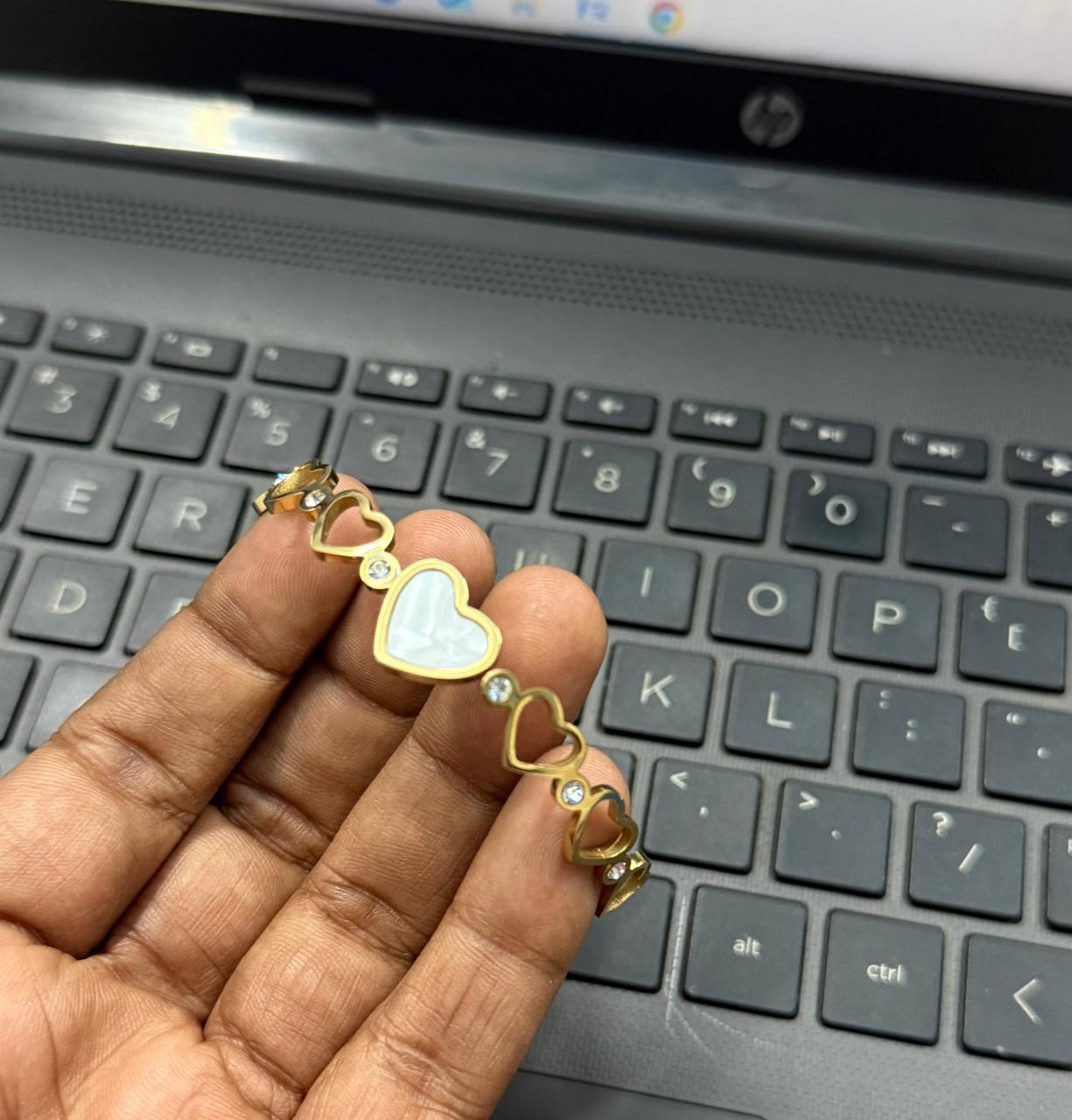 Gold bracelet with stone design