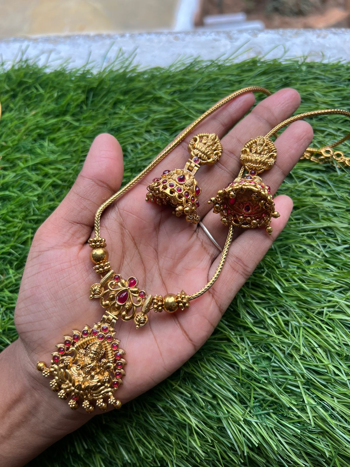 Pink ruby stone with lakshmi dollar gold neckpiece Pink ruby stone with lakshmi dollar gold neckpiece