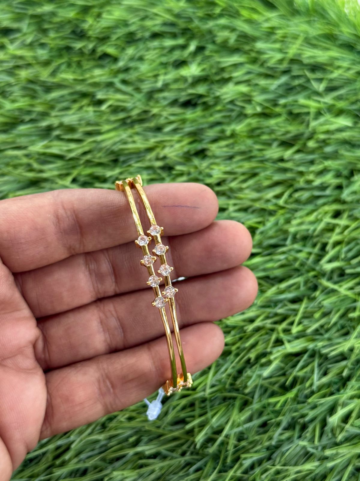 gold finish AD stone fancy bangle