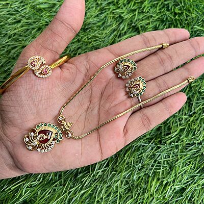 round based red color stone lakshmi with elephant hipblet