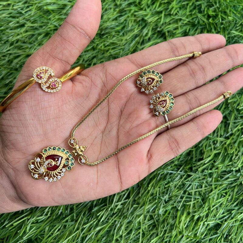 round based red color stone lakshmi with elephant hipblet
