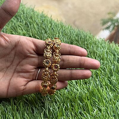 white stone peacock with gold based antic hipblet