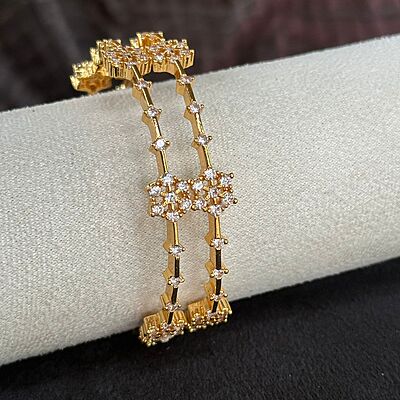 Gold finish AD stone flower design bangle Gold finish AD stone flower design bangle
